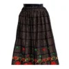 Black checked Nepali lehenga with red floral embroidery and maroon–gold border
