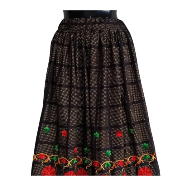 Black checked Nepali lehenga with red floral embroidery and maroon–gold border