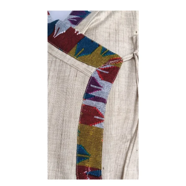 Close-up of Dhaka patterned border on beige cotton Daura