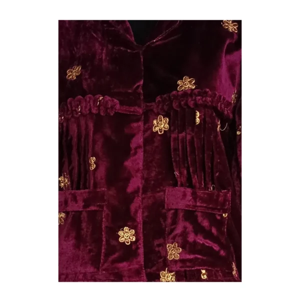 Close-up of gathered yoke pleats and butti on wine Cholo