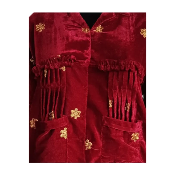 Close-up of gathered yoke pleats and gold butti on maroon Cholo