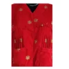 Close-up of pleated yoke and gold butti on red Cholo