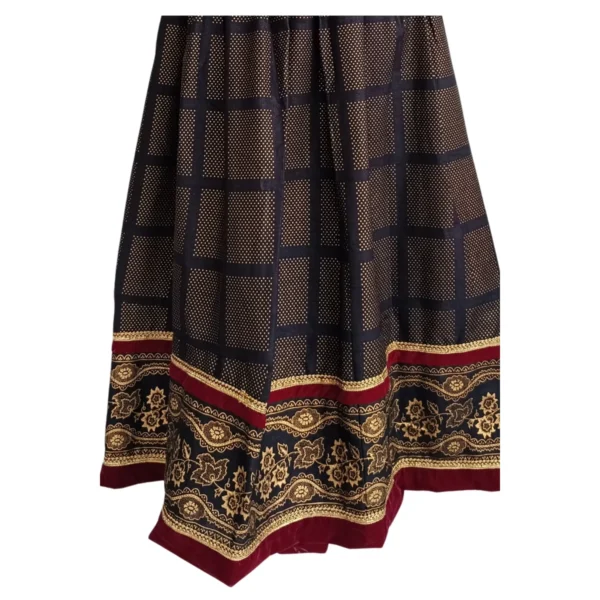 Hem detail of maroon bands and gold floral border on Nepali lehenga