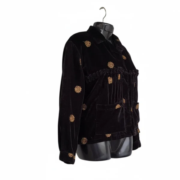 Side view of black velvet Rai Cholo with pockets and full sleeves
