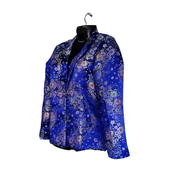 Side view of blue brocade Kuchin coat with lapel and gold buttons