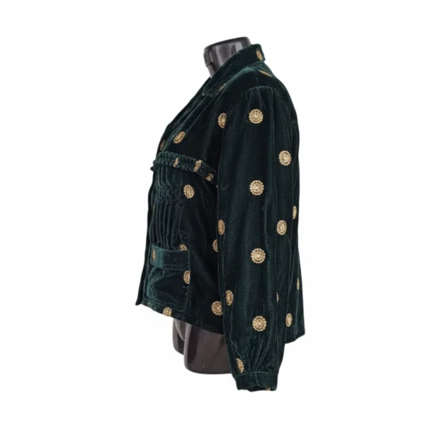 Side view of emerald velvet Rai Cholo with pockets and full sleeves