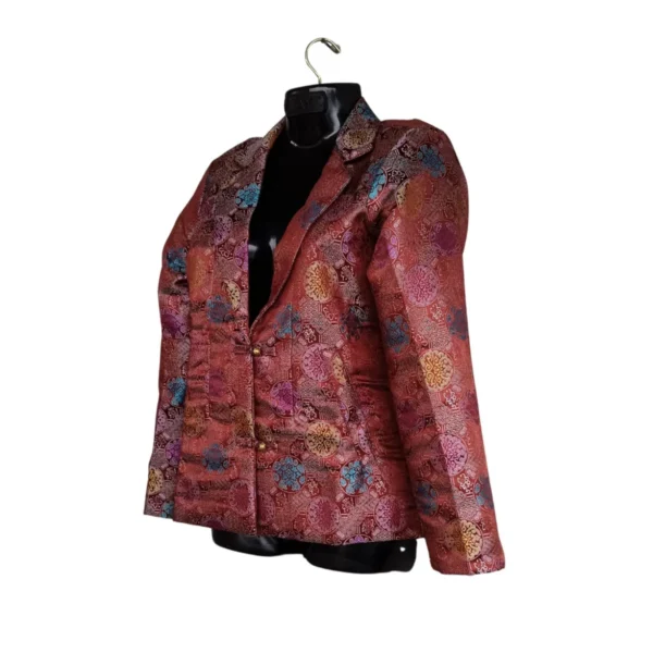 Side view of maroon brocade Kuchin coat with lapel and knot buttons