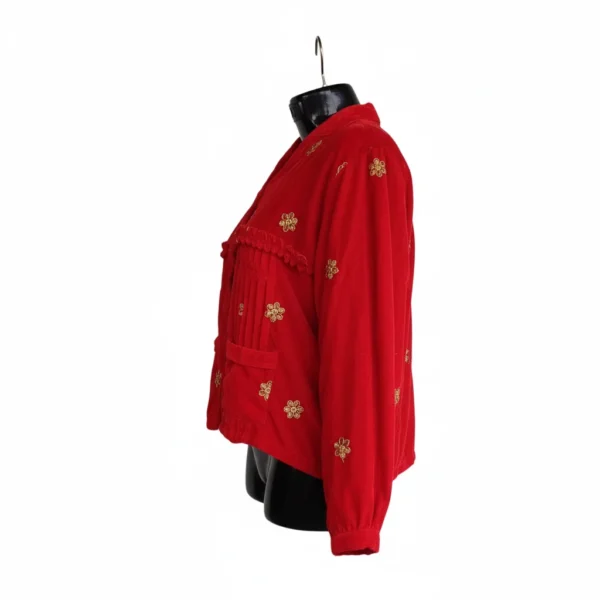 Side view of scarlet velvet Rai Cholo with gold butti and gathered yoke