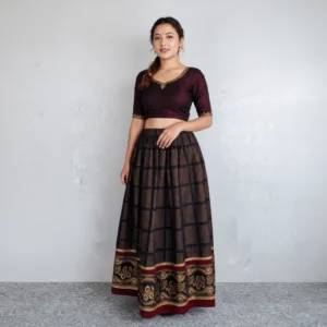 Woman wearing Black lehenga with maroon–gold border