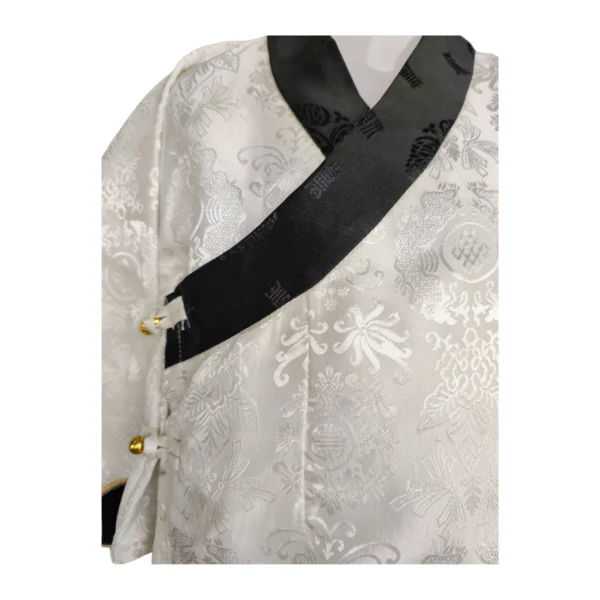Close-up of ivory kids toego bakhu with black jacquard border