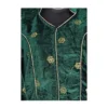 Close-up view of green velvet butti motifs and piping on Nepali blouse