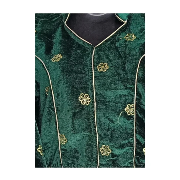 Close-up view of green velvet butti motifs and piping on Nepali blouse