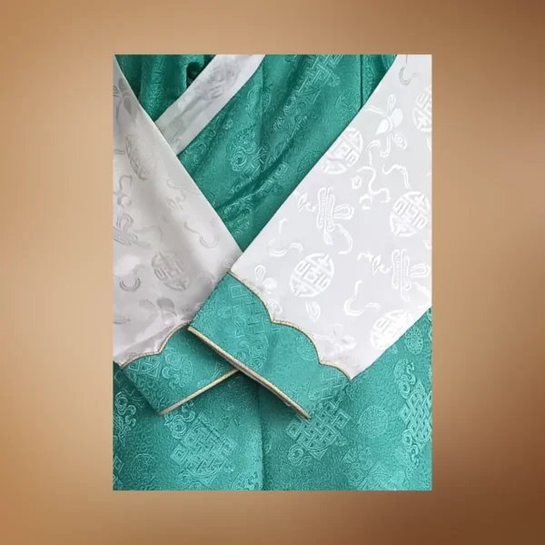 Detail of sea-green bakhu showing white wonju sleeve and woven auspicious motifs