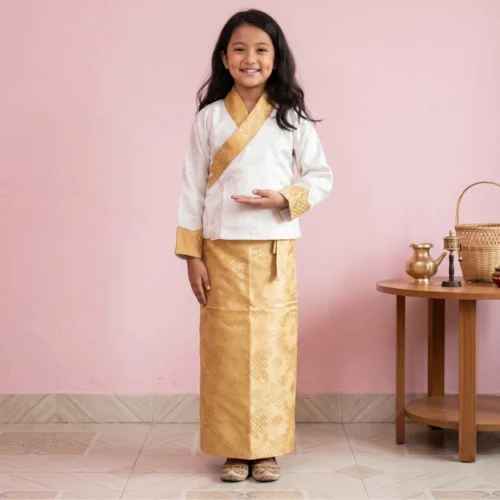 Girl wearing ivory bakhu with gold border and gold skirt