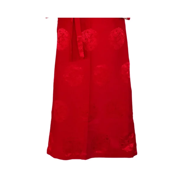 Red jacquard wrap skirt with woven medallions and tie belt