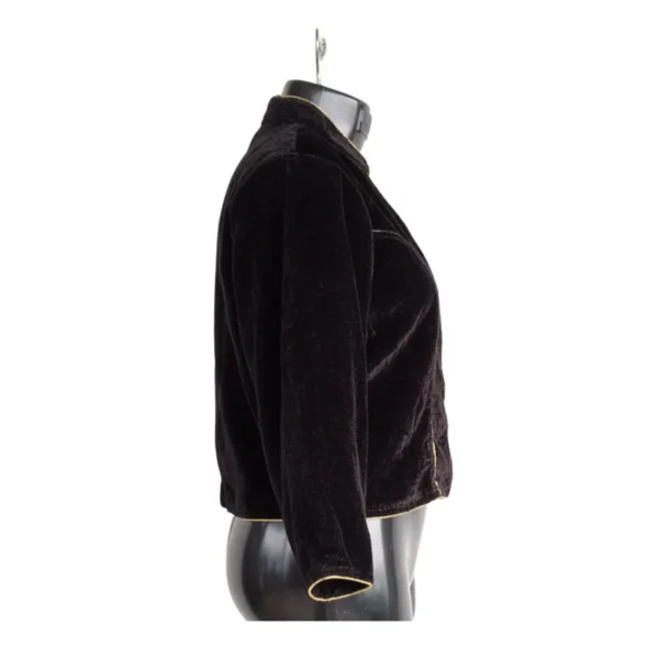 Side view of black velvet blouse showing sleeve and hem finish