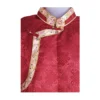 close up detail view of red jacquard Khenja with cream floral border