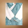 teal bakhu crossover neckline and cuff detail with brooch pin