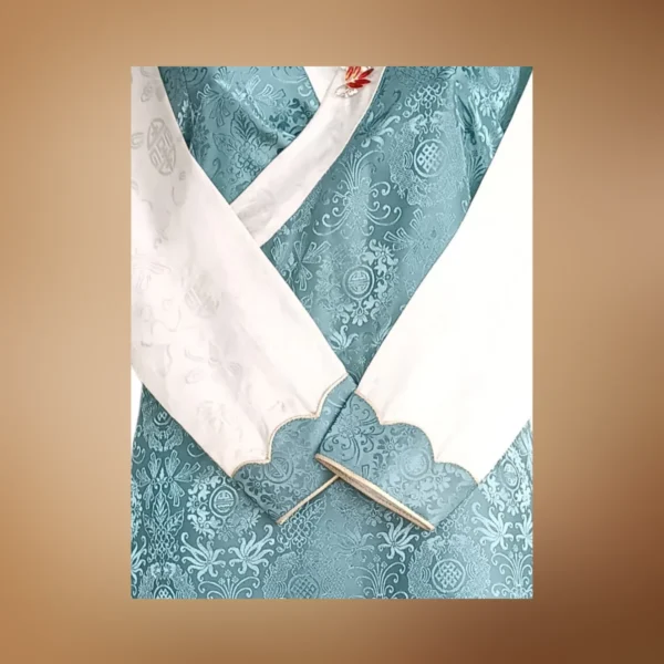 teal bakhu crossover neckline and cuff detail with brooch pin