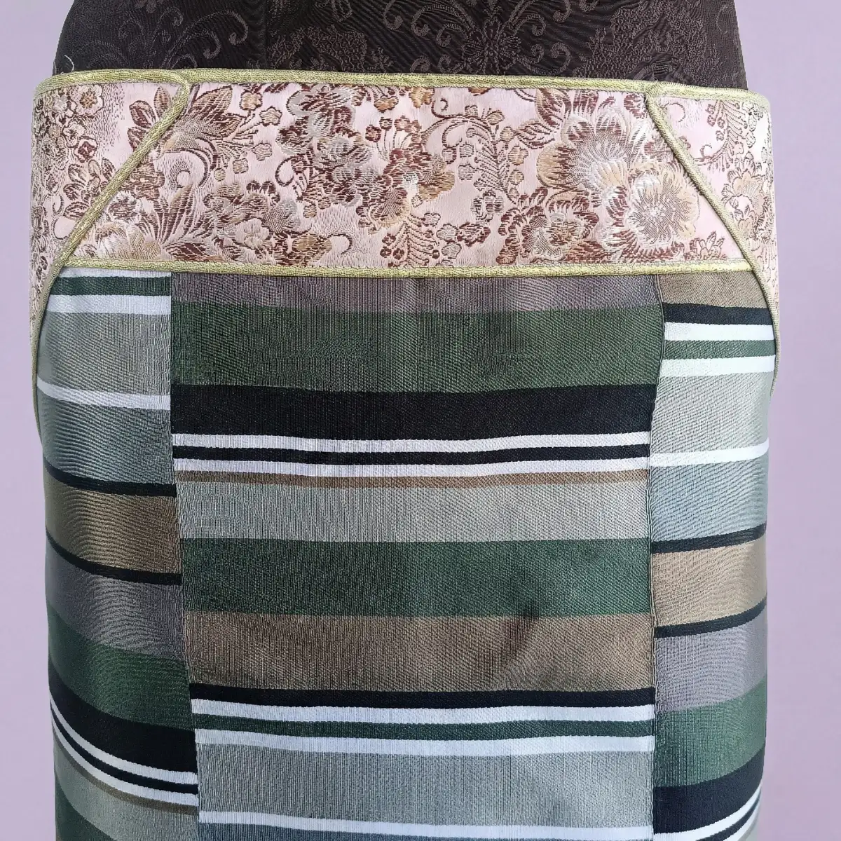 Close-up of Magenta border and multicolour stripes on Pangden apron