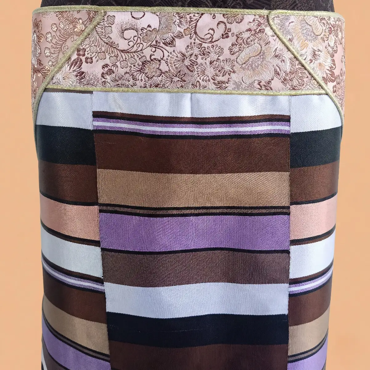 Close-up of Pink border and multicolour stripes on Pangden apron Close-up of Pink border and multicolour stripes on Pangden apron