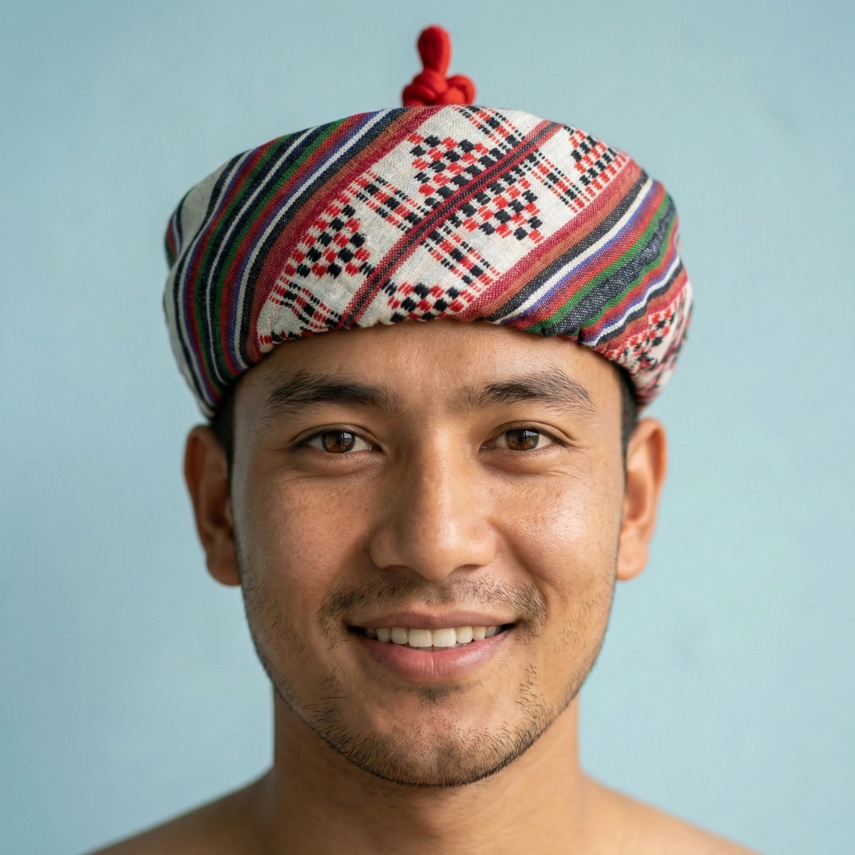 Men's Lepcha Topi fully woven style — multi-colour traditional motif bands across structured poly-cotton crown