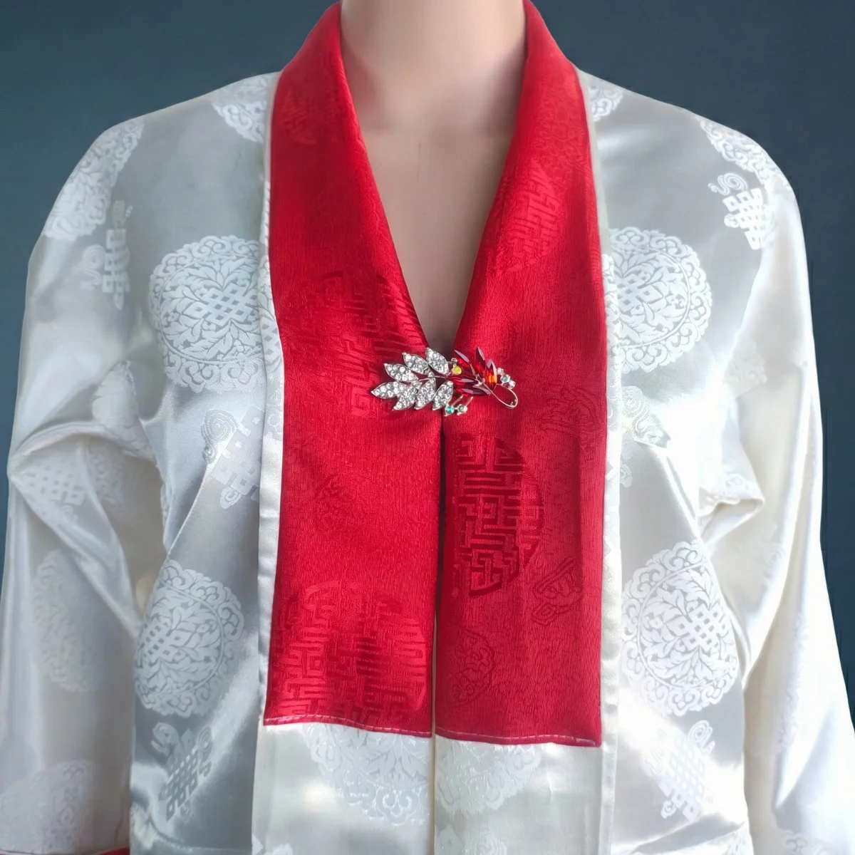 closeup view of white jacquard Tego top