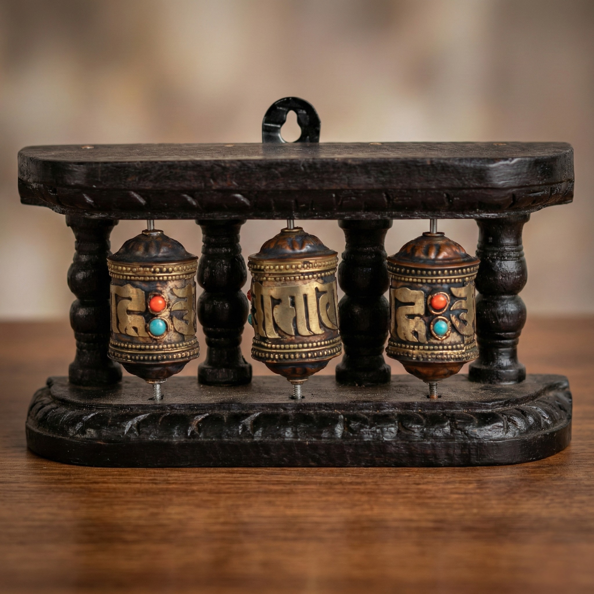 3-wheel Tibetan prayer wheel stand — brass Om Mani Padme Hum wheels with coral and turquoise inlay on dark carved wood
