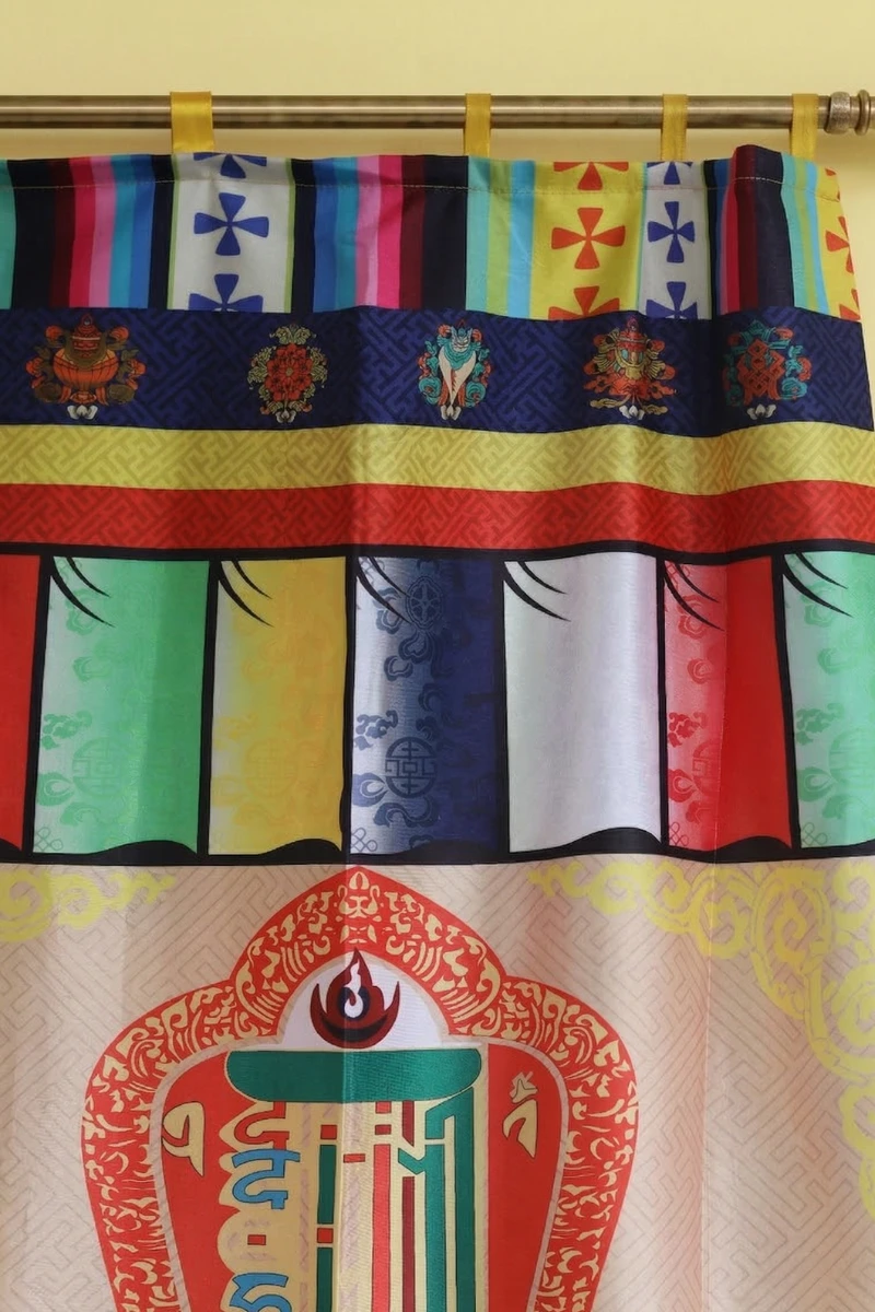 Close up view of Tibetan door curtain with Kalachakra Namchu Wangden and Dharma Wheel