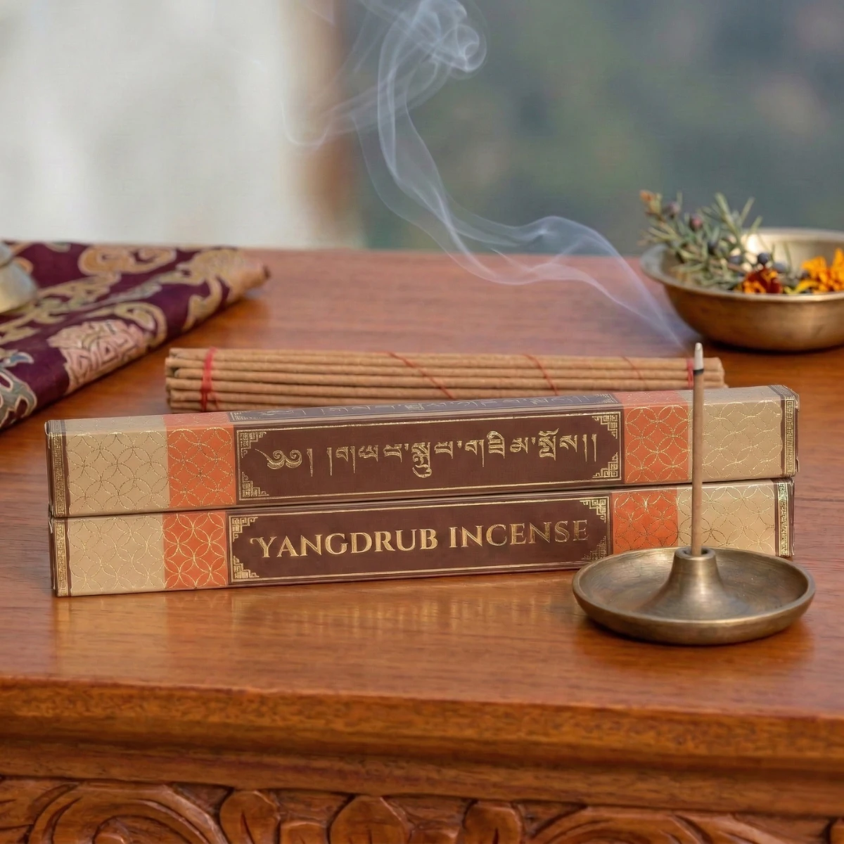 Yangdrub Incense pack of 2 — gold Tibetan script box with lit stick in brass holder — auspicious luck offering, Himalayan herbal incense