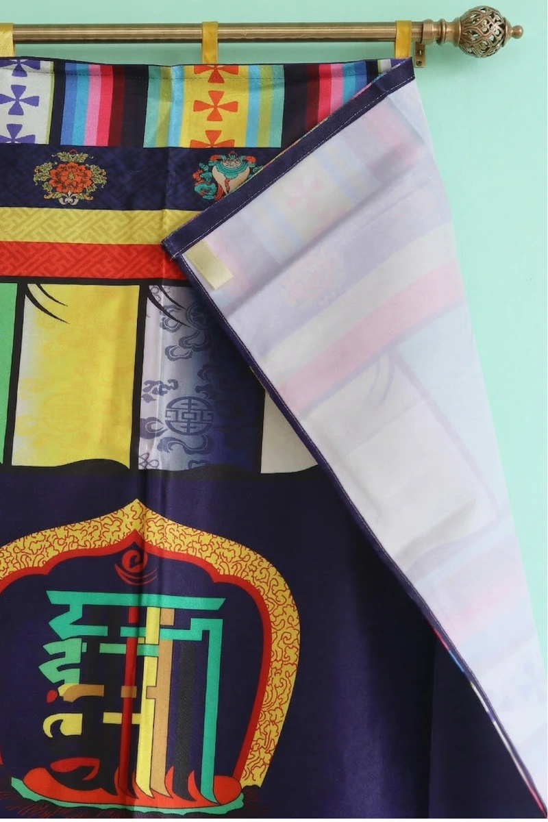 close up design of Tibetan door curtain with Namchu Wangden, Ashtamangala symbols, and goldfish on navy blue