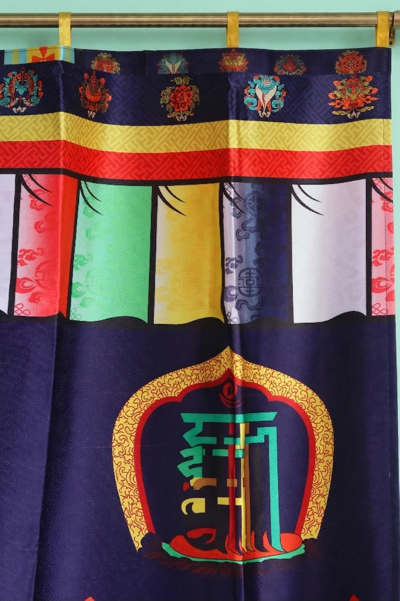 close up view of Tibetan door curtain with Namchu Wangden, Ashtamangala symbols, and goldfish on navy blue