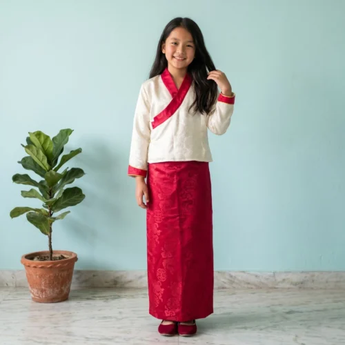 Girl wearing Raspberry pink Kids Two Piece Bakhu jacquard set full body front view