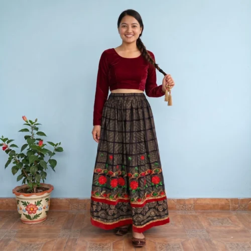 Girl wearing black checked Nepali lehenga with velvet crop top full body