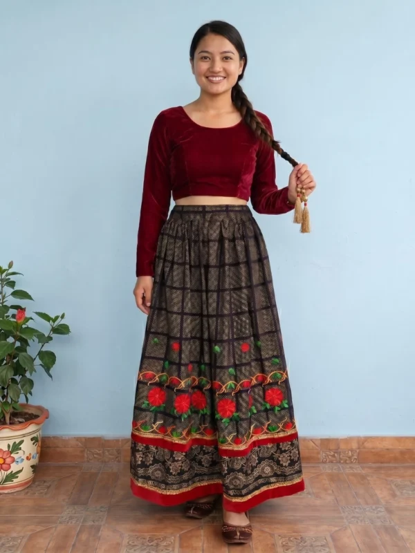 Girl wearing black checked Nepali lehenga with velvet crop top full body