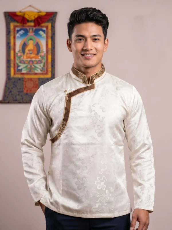 Man wearing ivory Akash Gola Khenja with brown brocade trim front view