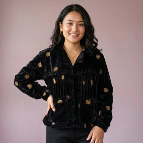 Woman wearing Black velvet Rai Cholo with handcrafted gold motifs full body front view