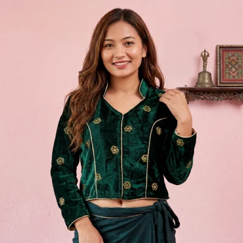 Woman wearing Green embroidered velvet Mandarin collar blouse front view with gold piping