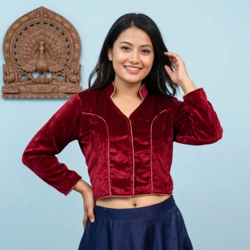 Woman wearing Maroon velvet blouse Mandarin collar front view with gold piping and 3 4 sleeves