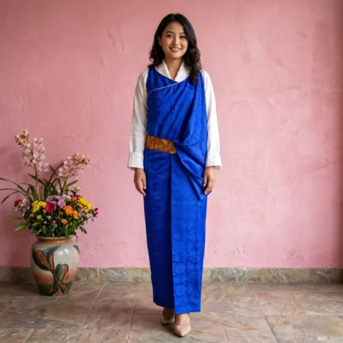 Woman wearing Royal blue jacquard Lepcha Gada wrap dress full body front view with leather belt