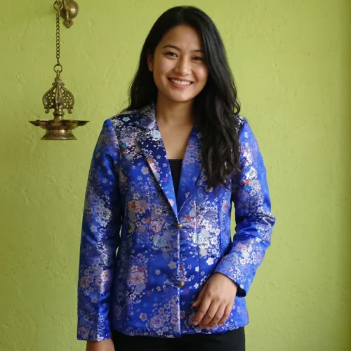 Woman wearing royal blue Tash Kuchin coat