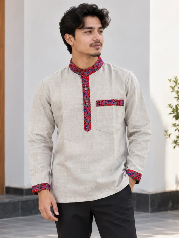 Man wearing beige modern daura shirt with pocket red multi Dhaka trim, front view