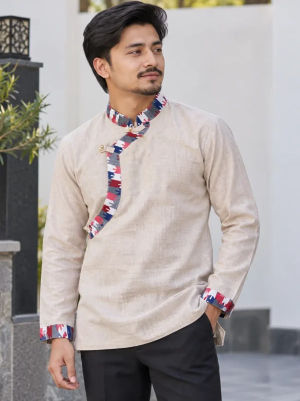 Man wearing beige Nepali daura shirt with multicolour Dhaka border, front view