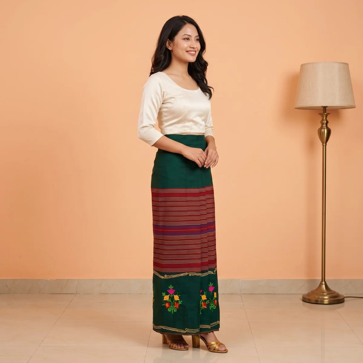 Embroidered Tamang Wrapper — Women's Phariya Skirt 2 Woman wearing green tamang phariya skirt embroidered panel, side view