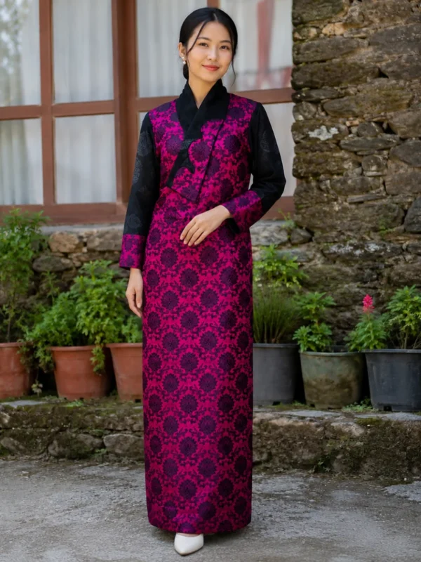 Woman wearing magenta petal collar bakhu with black satin sleeves front view