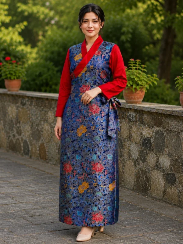Woman wearing navy blue tibetan brocade wrap dress with red sleeves front view