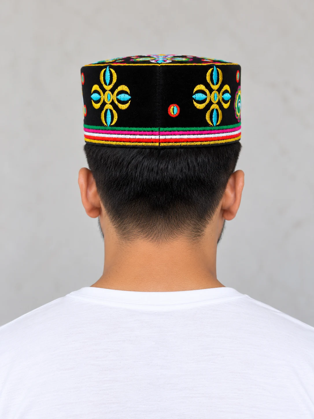 Embroidered Velvet Tamang Topi for Men 26 Man wearing black embroidered velvet topi back view