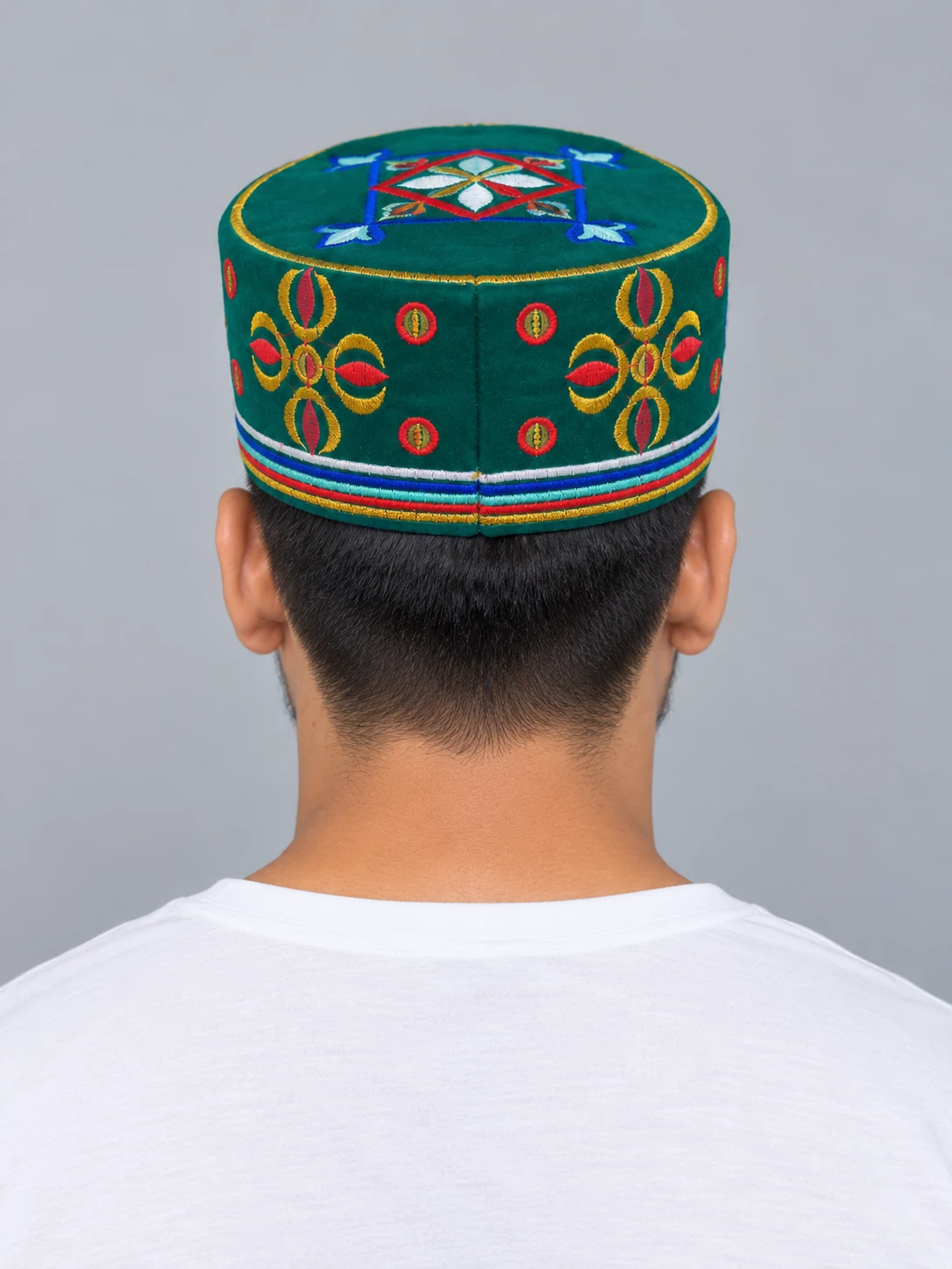 Embroidered Velvet Tamang Topi for Men 10 Man wearing emerald embroidered velvet topi back view
