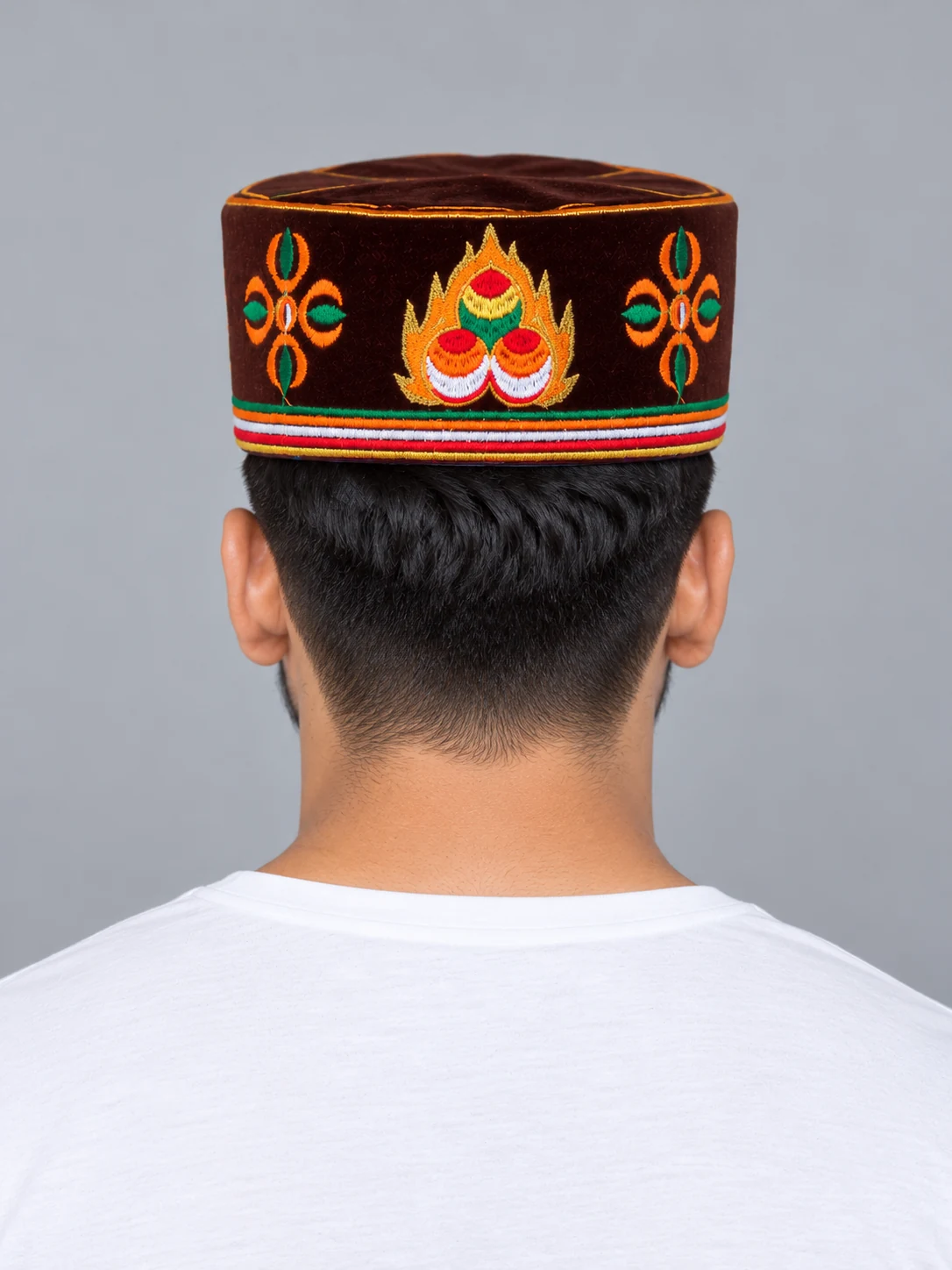 Embroidered Velvet Tamang Topi for Men 4 Man wearing maroon embroidered velvet topi back view