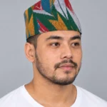 Man wearing mustard teal chevron printed nepali topi front view